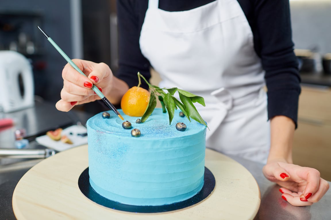 Confectioner Decorates Cake