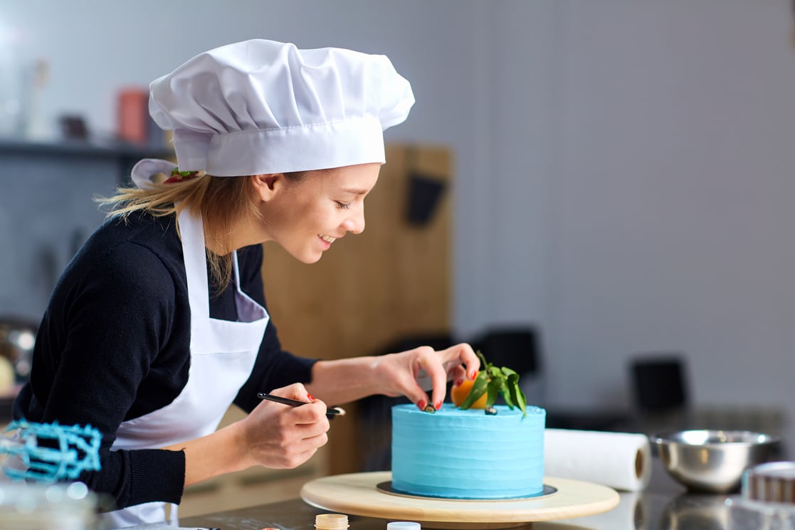 Confectioner Decorating Cake