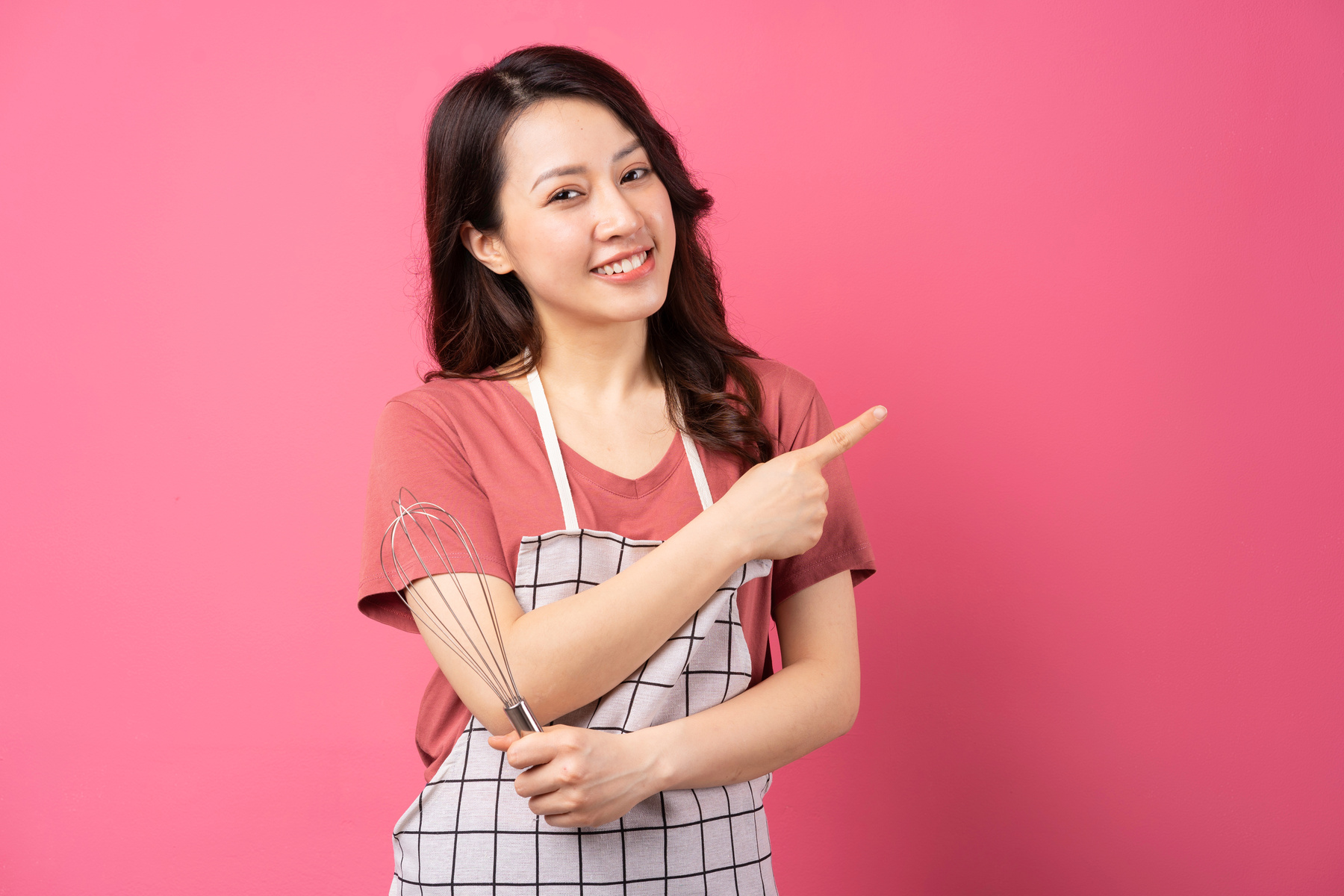 Portrait of Female Baker on Pink Background